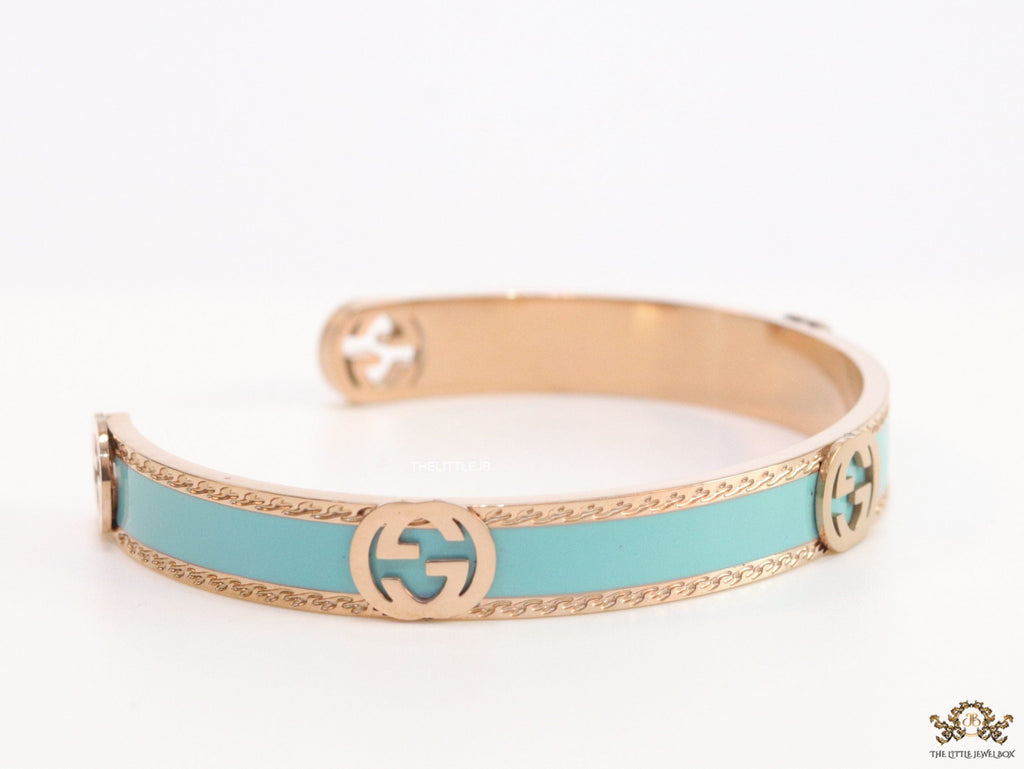 Blue and Rose gold open band bracelet with twin G alphabet motifs