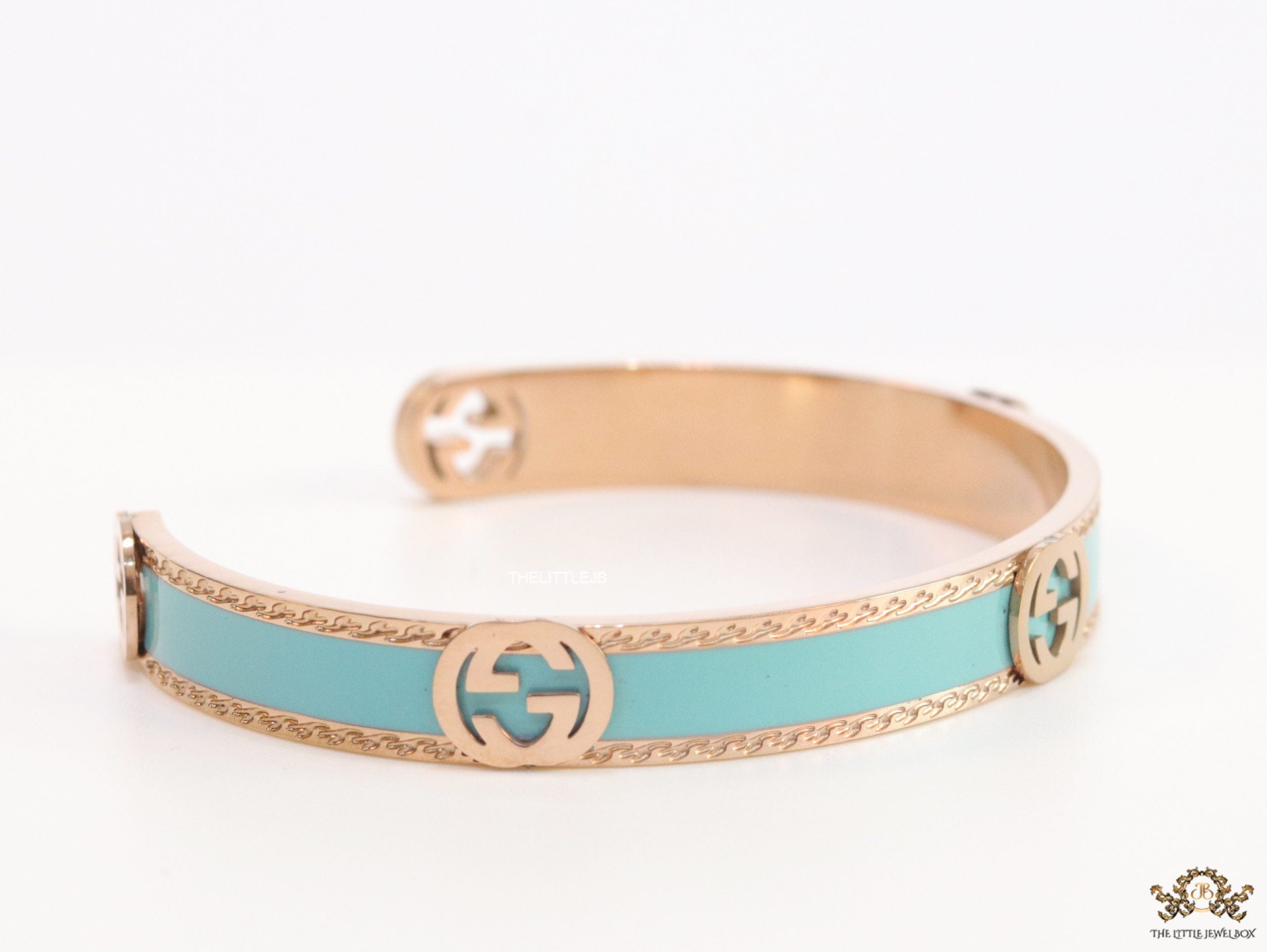 Blue and Rose gold open band bracelet with twin G alphabet motifs