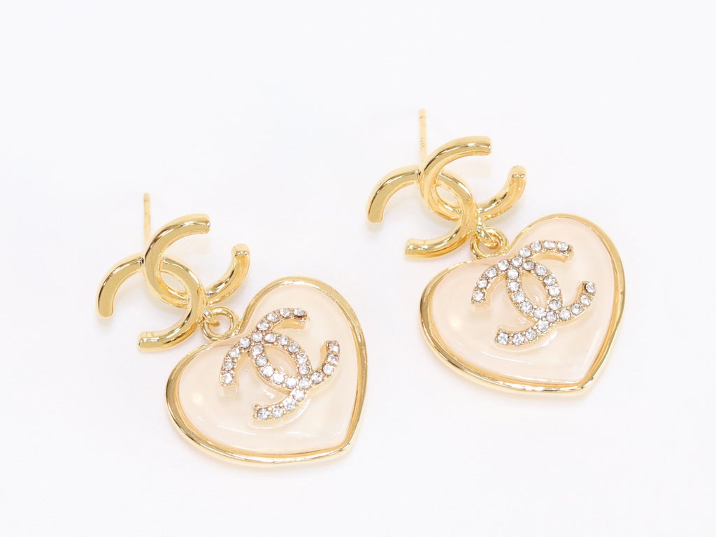 Double C on dangling cream heart gold earrings with CZ