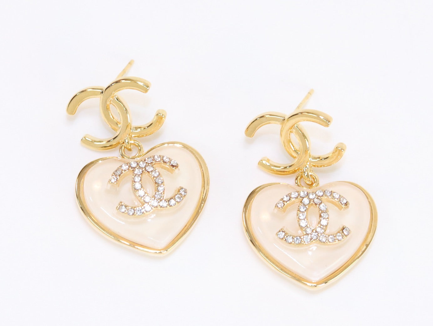 Double C on dangling cream heart gold earrings with CZ