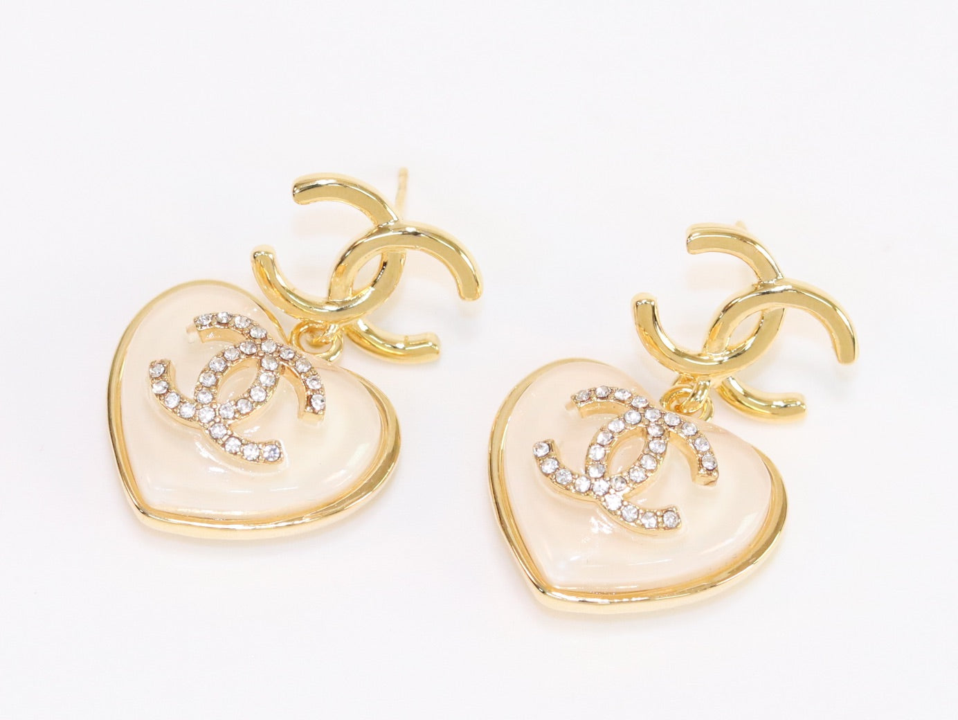 Double C on dangling cream heart gold earrings with CZ