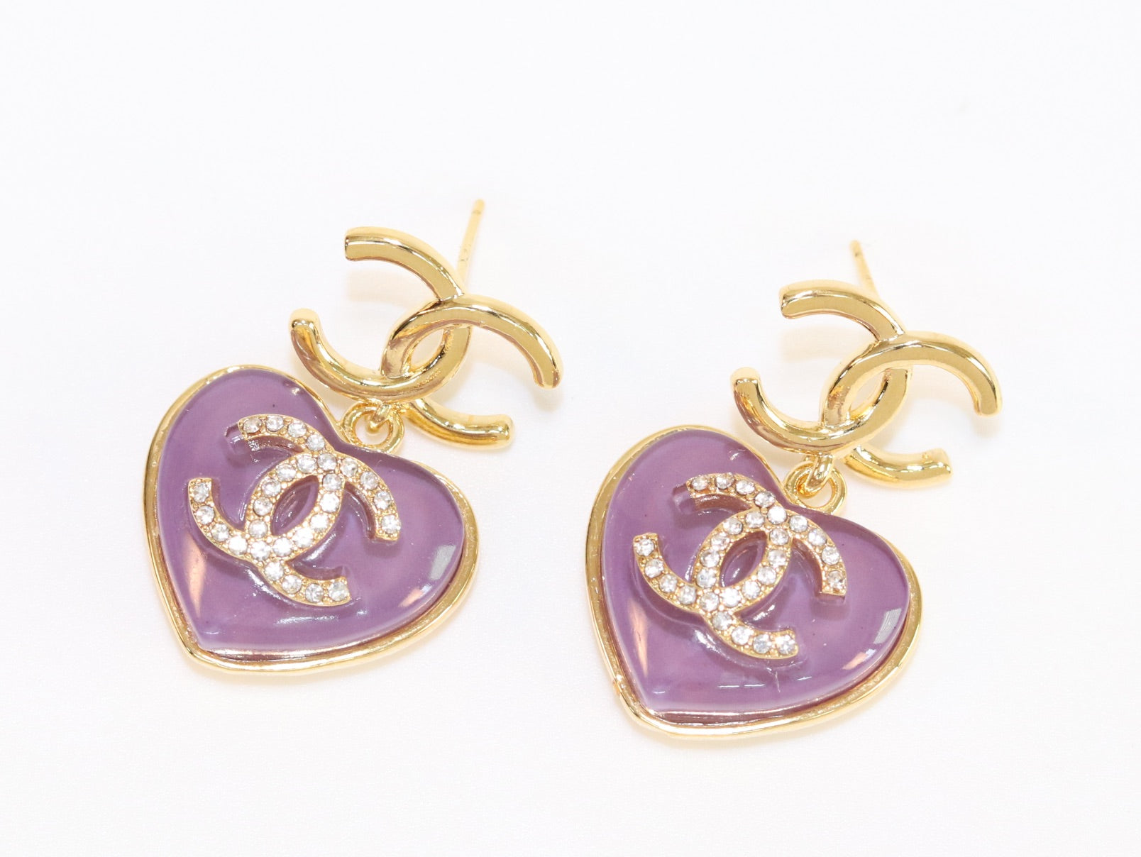 Double C on dangling purple heart gold earrings with CZ