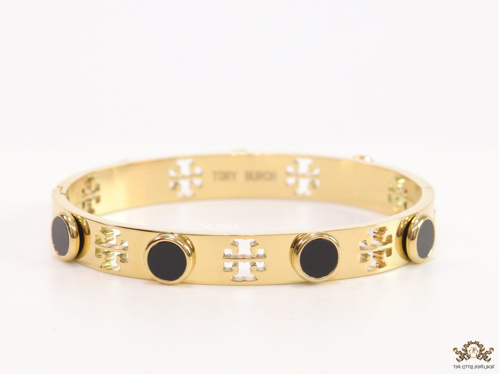 Gold plated cutwork twin T motif bracelet with black stones