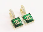 Double C on dangling green square gold earrings with CZ