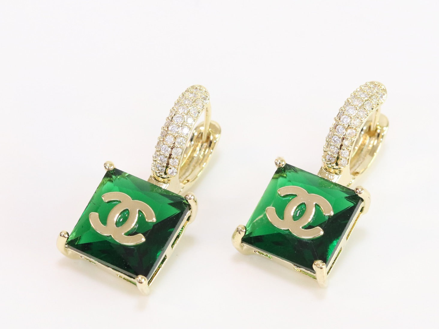 Double C on dangling green square gold earrings with CZ
