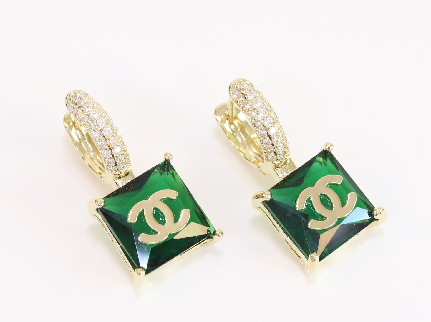 Double C on dangling green square gold earrings with CZ