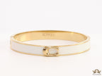 Sleek white and golden bracelet with C alphabet in centre