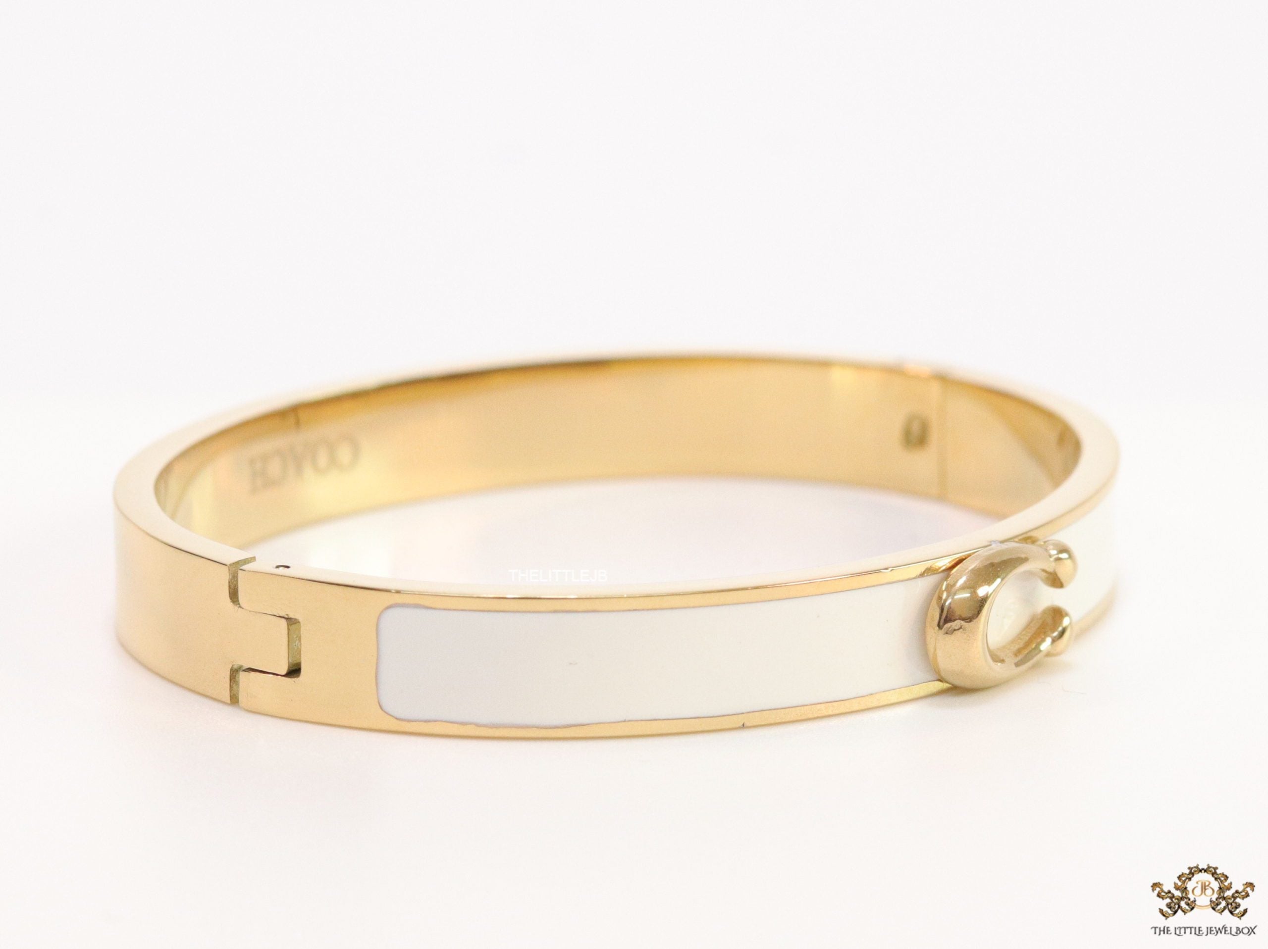 Sleek white and golden bracelet with C alphabet in centre