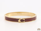 Sleek maroon and golden bracelet with C alphabet in centre