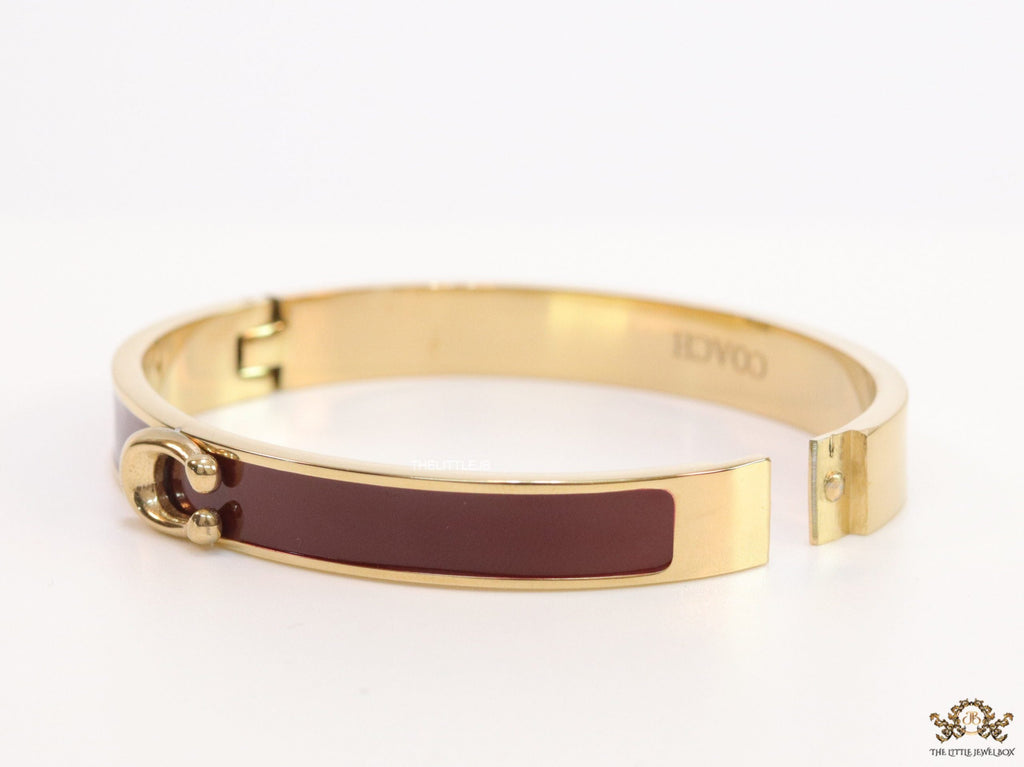 Sleek maroon and golden bracelet with C alphabet in centre