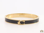 Sleek black and golden bracelet with C alphabet in centre