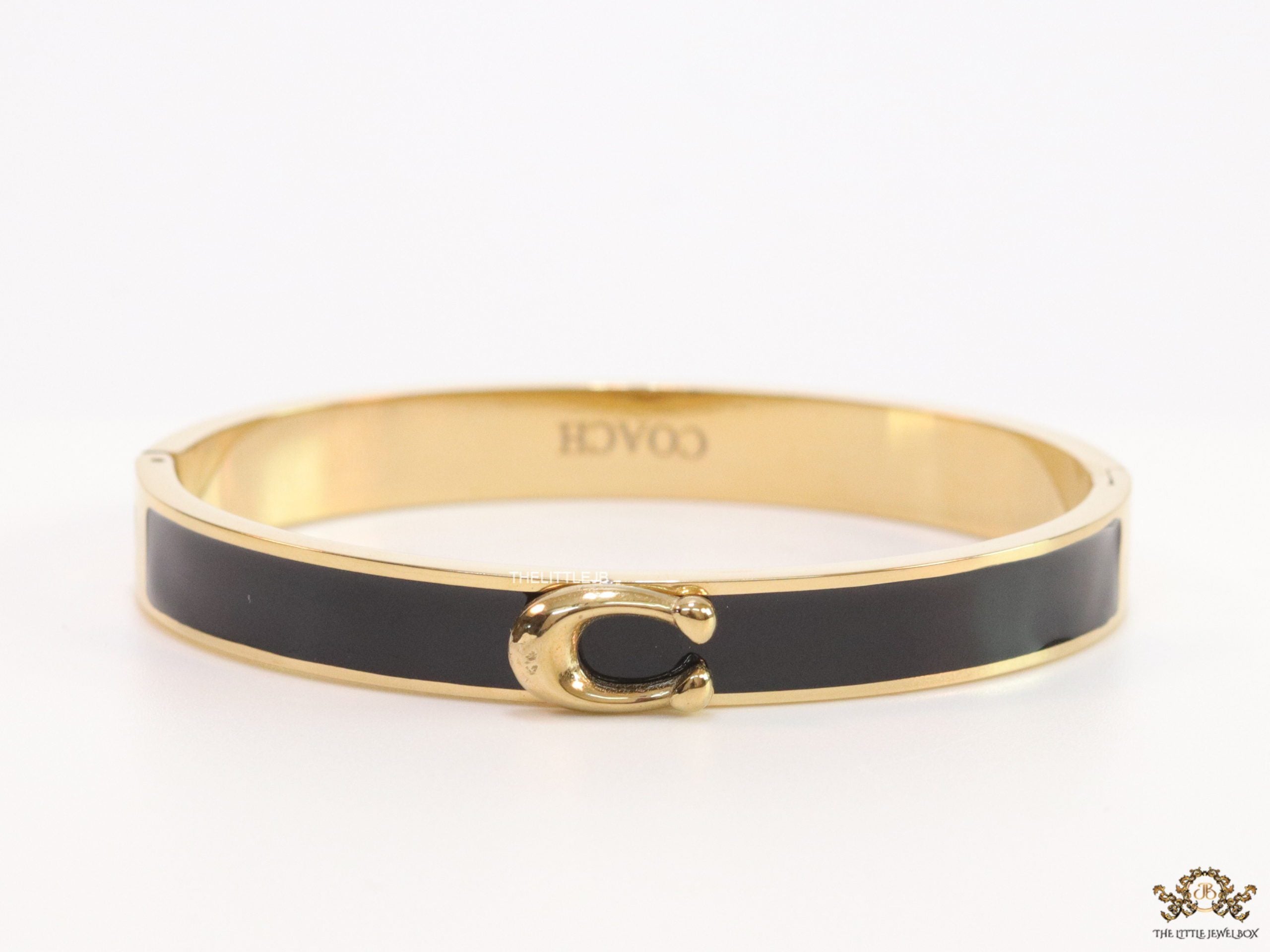 Sleek black and golden bracelet with C alphabet in centre
