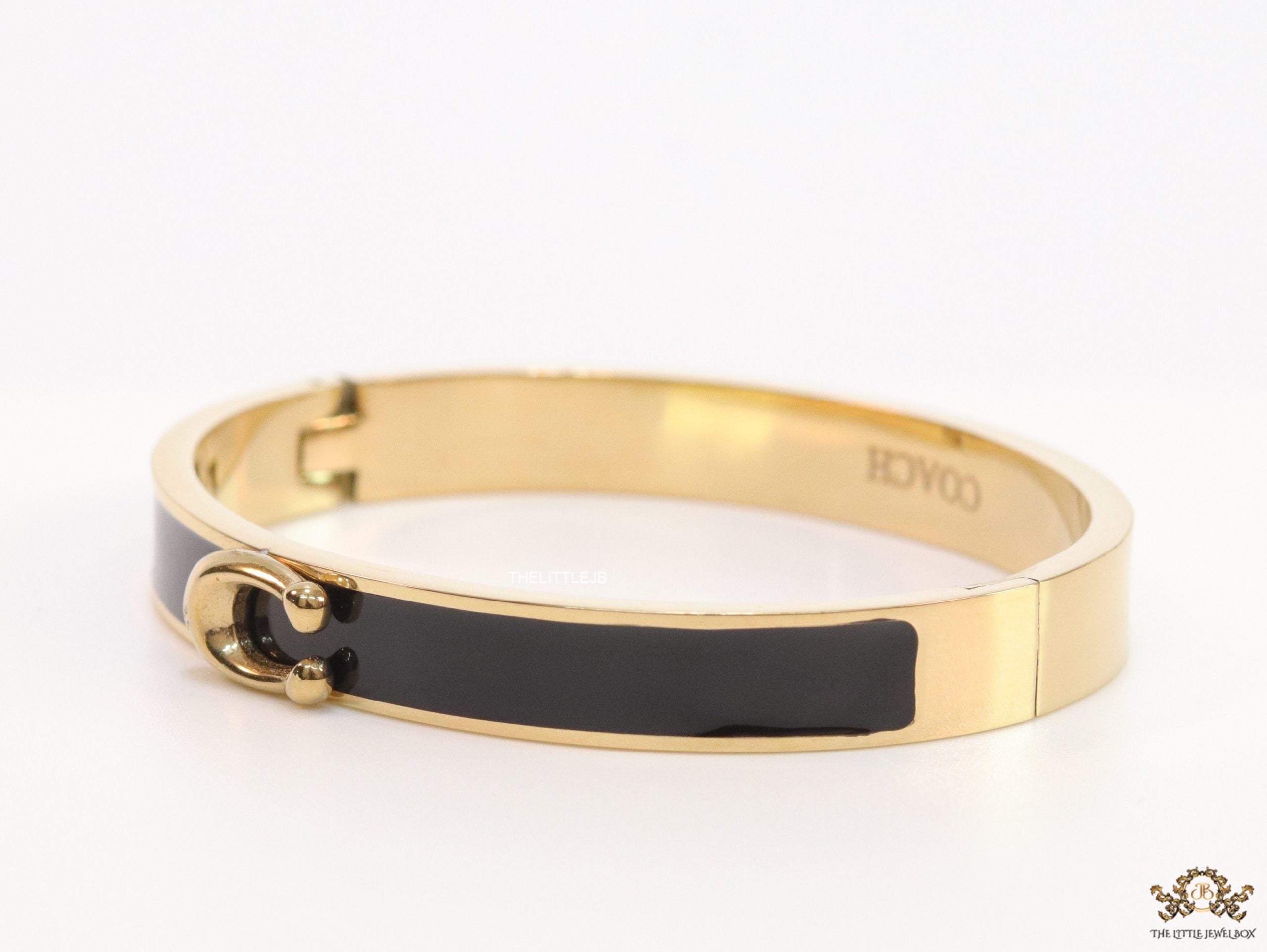 Sleek black and golden bracelet with C alphabet in centre
