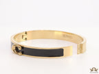 Sleek black and golden bracelet with C alphabet in centre
