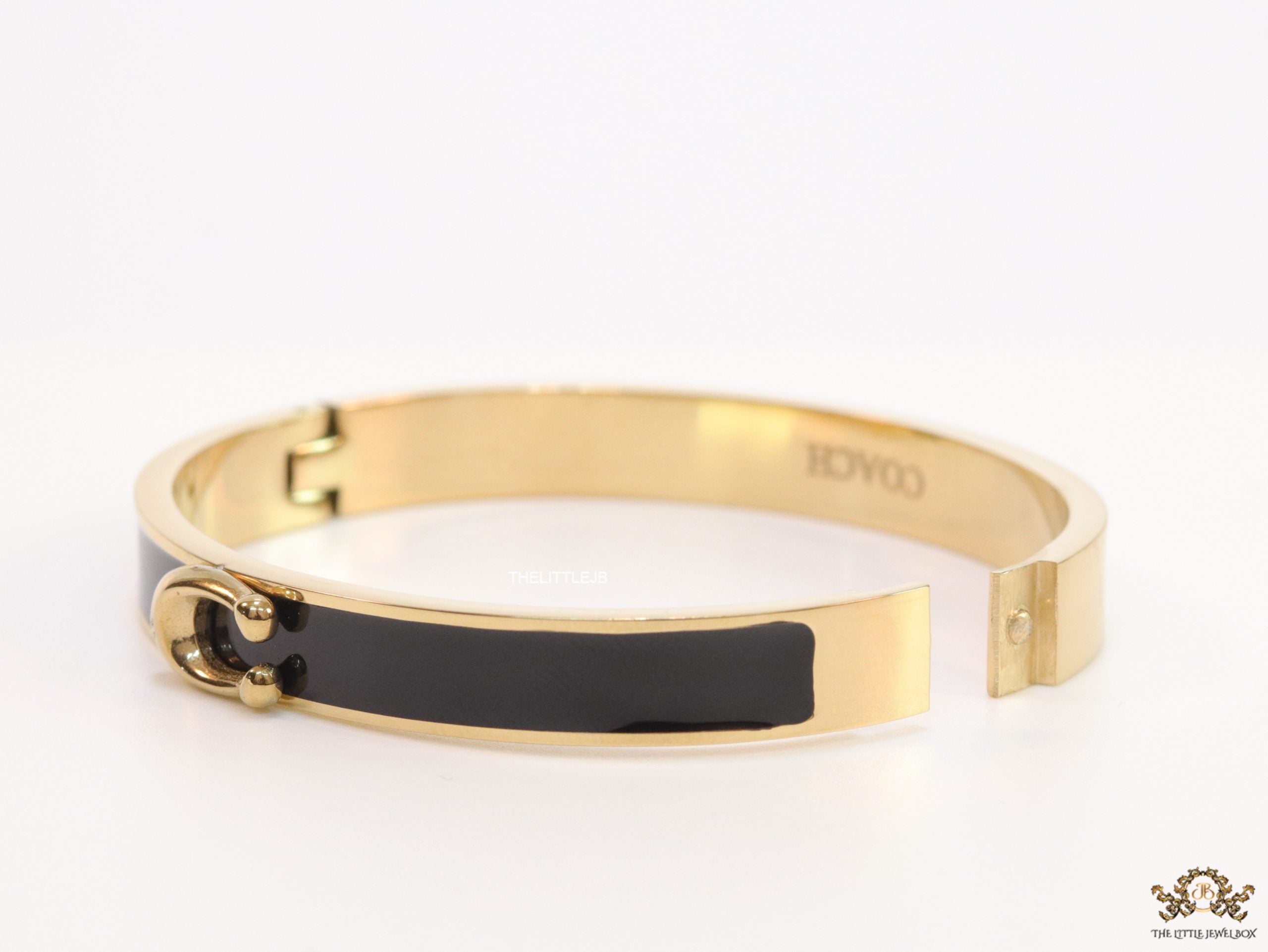 Sleek black and golden bracelet with C alphabet in centre