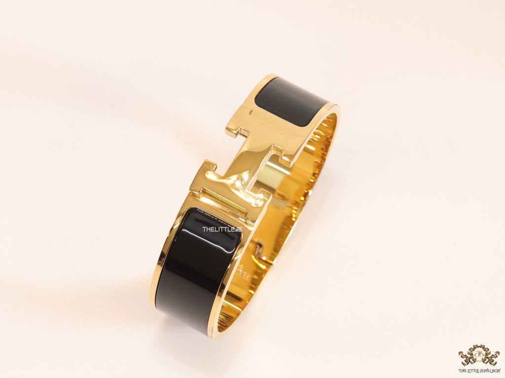 Openable H motif 18mm black bracelet in a shiny gold plating