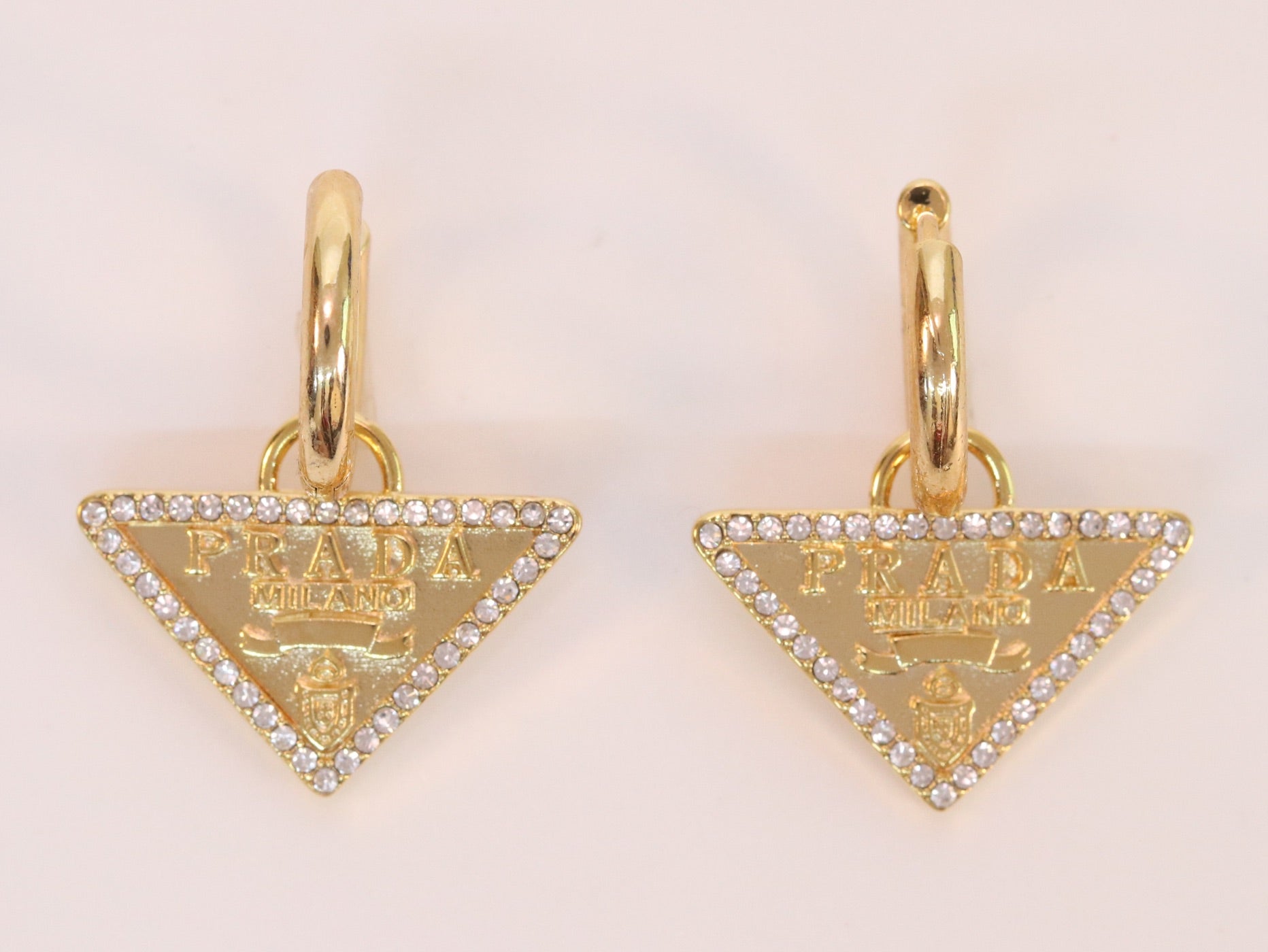 Gold Dangling Triangle earrings on small hoops with CZ