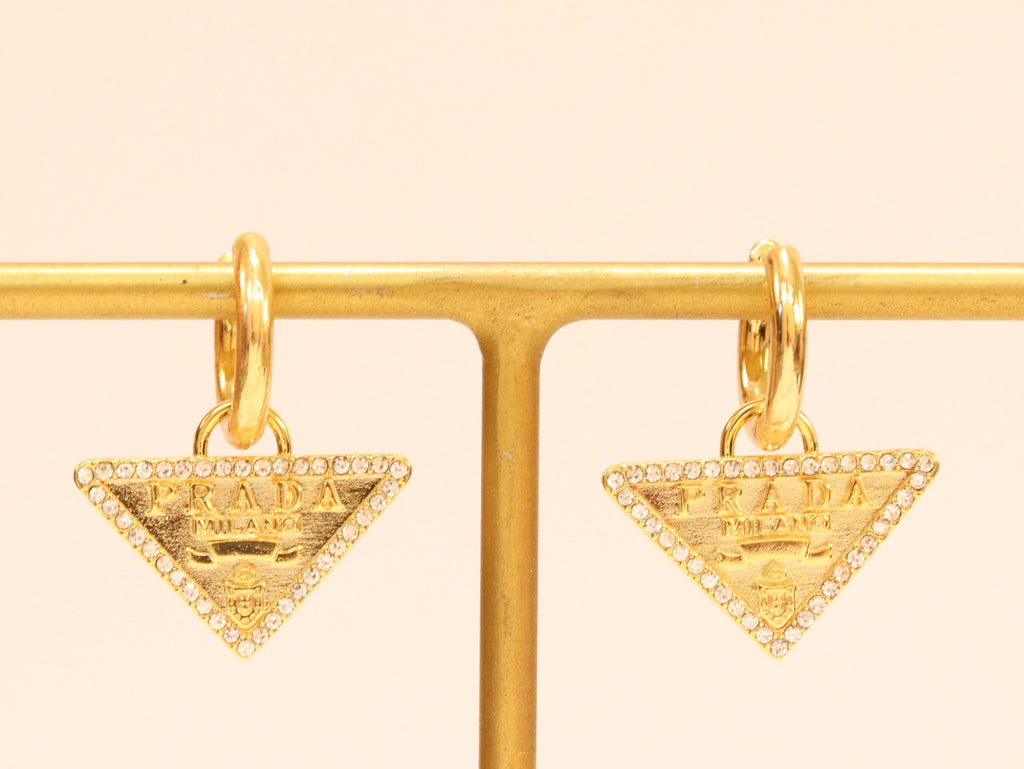 Gold Dangling Triangle earrings on small hoops with CZ
