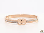 Rose gold plated bracelet with cz, inscribed alphabets and twin disc motif