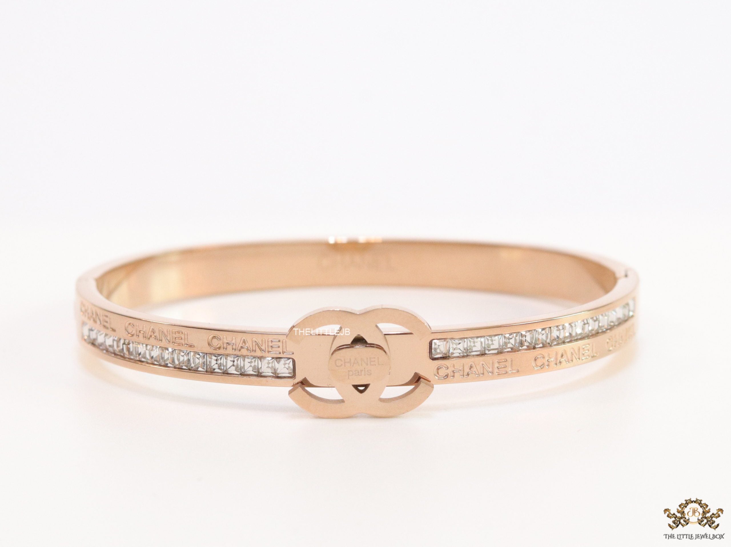 Rose gold plated bracelet with cz, inscribed alphabets and twin disc motif