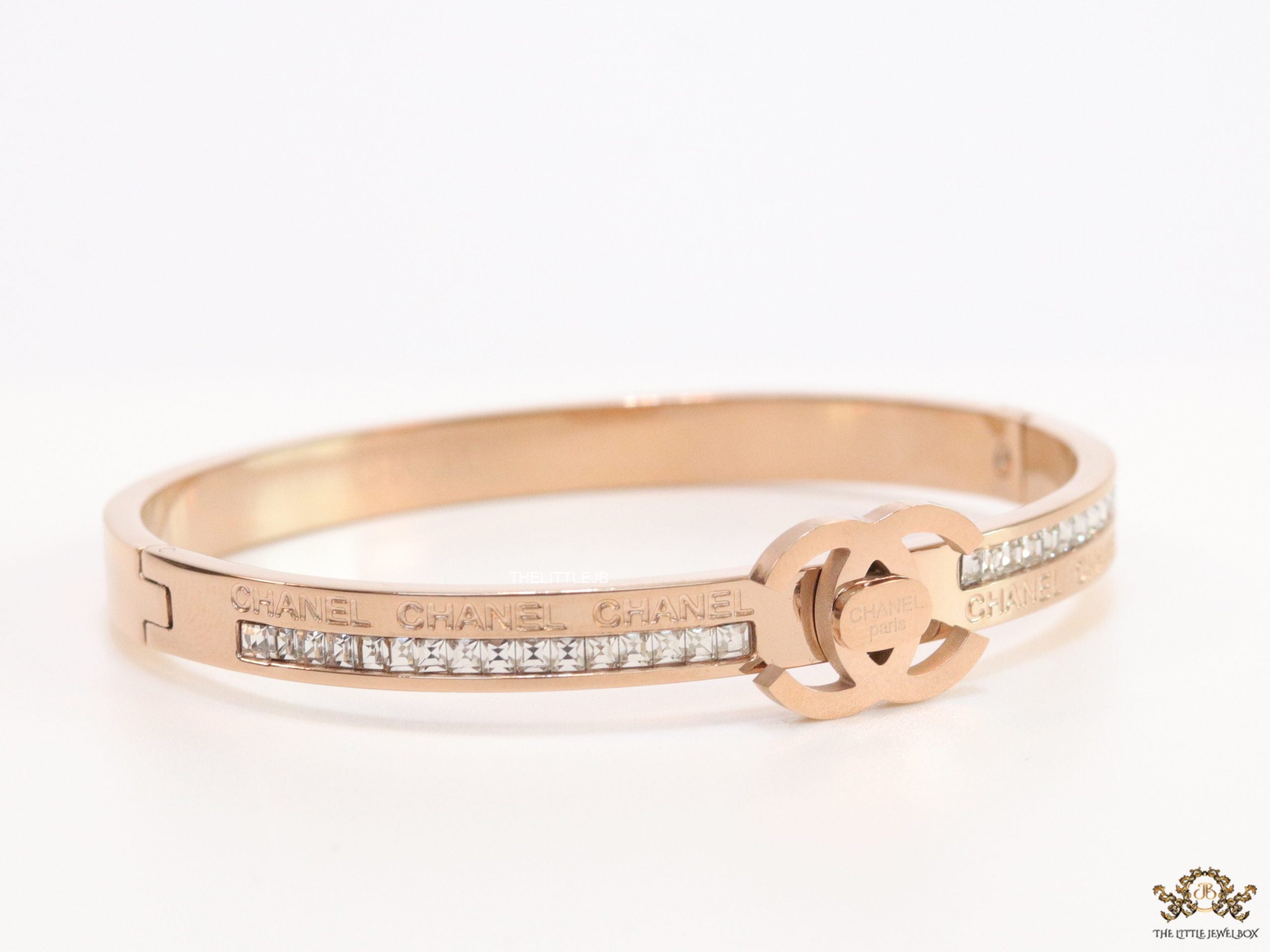 Rose gold plated bracelet with cz, inscribed alphabets and twin disc motif