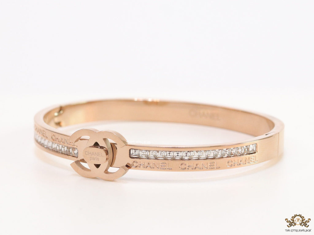 Rose gold plated bracelet with cz, inscribed alphabets and twin disc motif