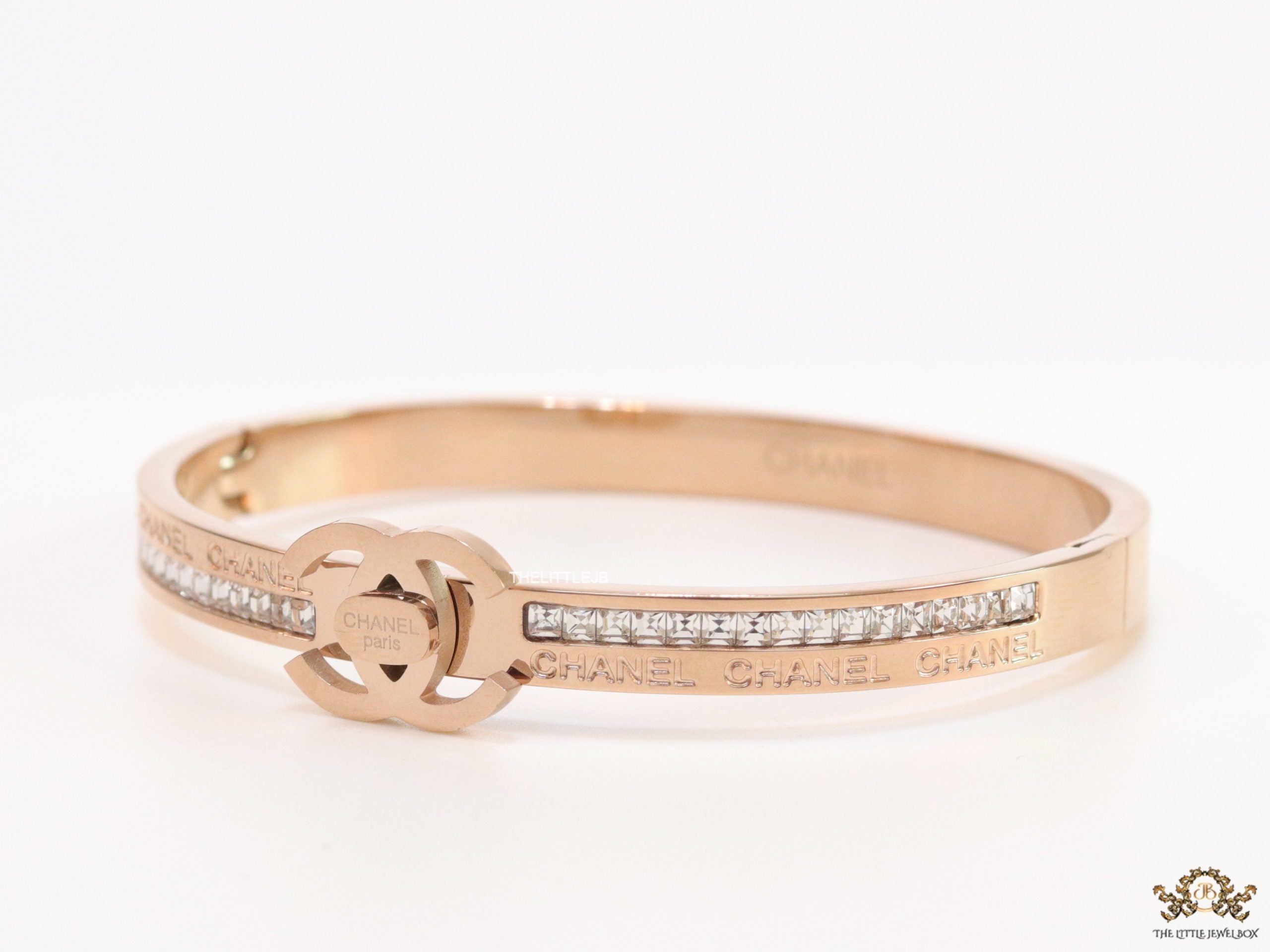 Rose gold plated bracelet with cz, inscribed alphabets and twin disc motif