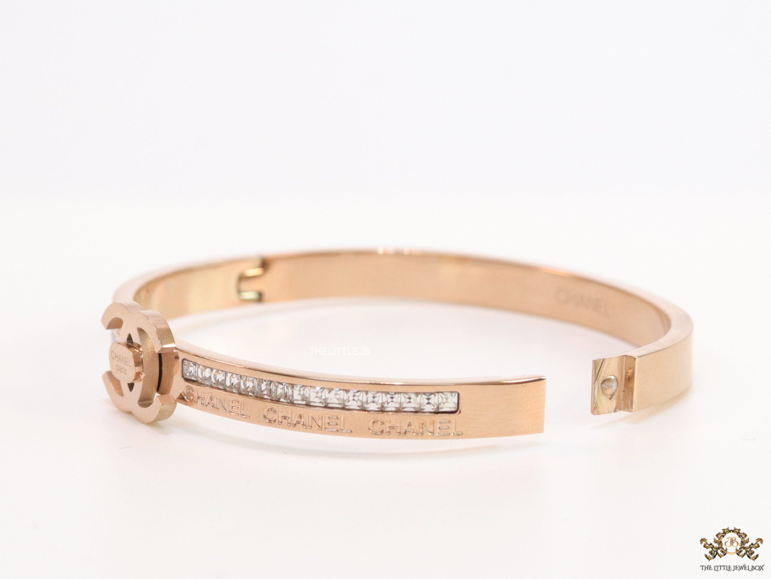 Rose gold plated bracelet with cz, inscribed alphabets and twin disc motif
