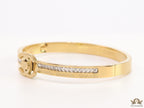 Gold plated bracelet with cz, inscribed alphabets and twin disc motif