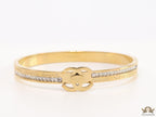 Gold plated bracelet with cz, inscribed alphabets and twin disc motif