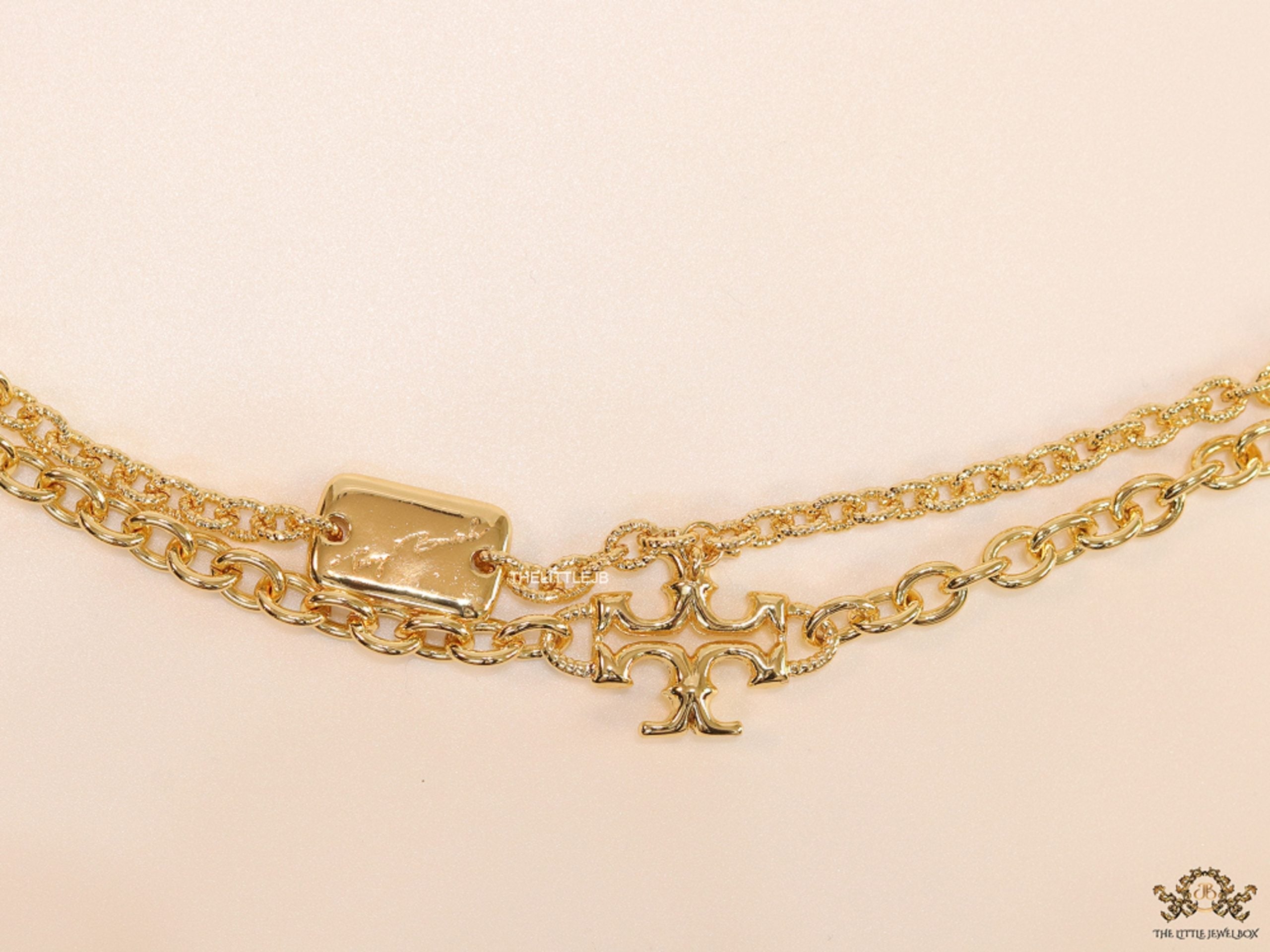 Gold plated two layered link chain bracelet with T motif