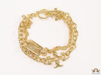 Gold plated two layered link chain bracelet with T motif