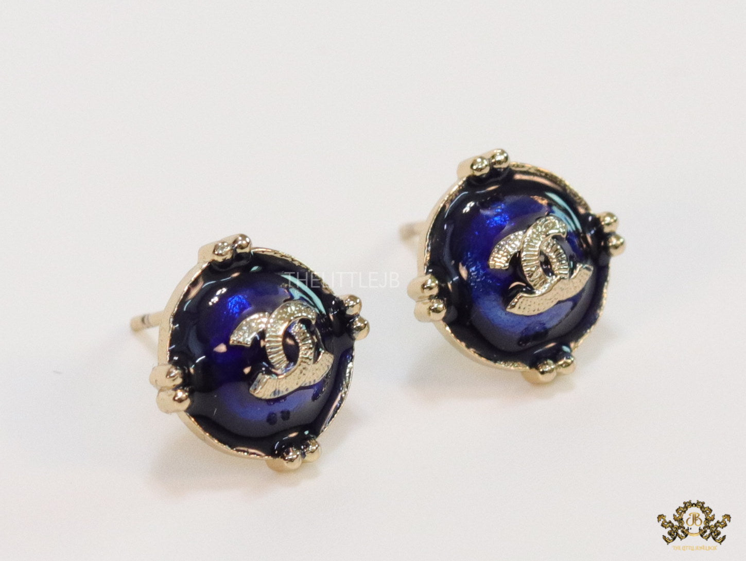 Royal blue studs with double C in centre