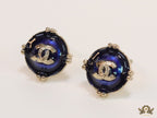Royal blue studs with double C in centre