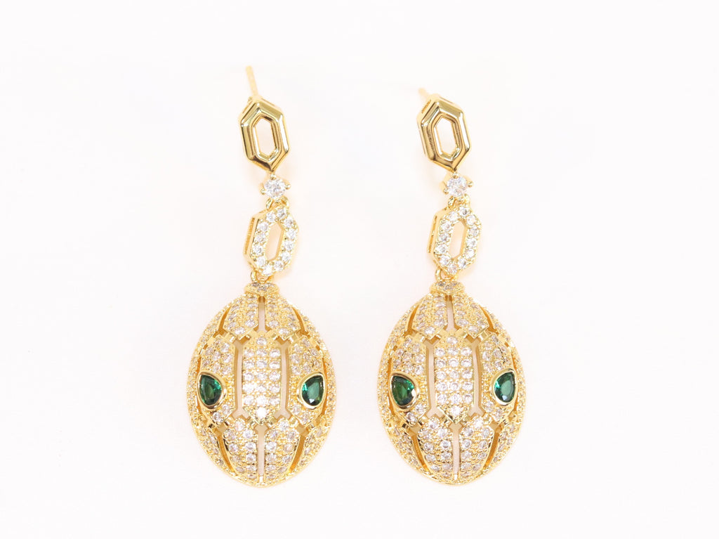 Gold Snake head pendant set with emerald detailing