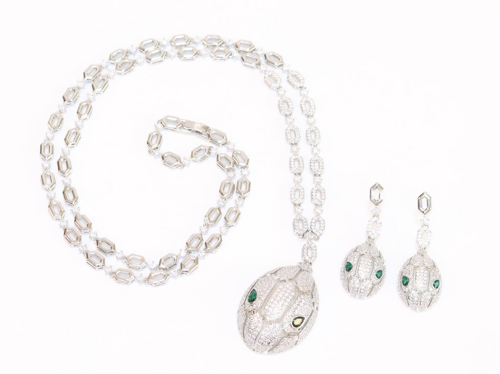 Platinum Snake head pendant set with emerald detailing