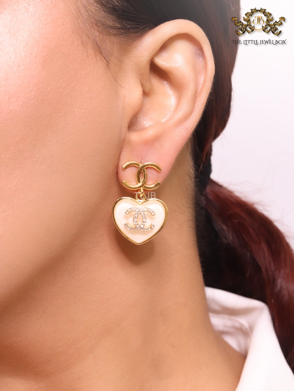 Double C on dangling cream heart gold earrings with CZ