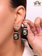 Double C gold danglers with 5 in CZ on black enamel