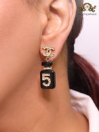 Double C gold danglers with 5 in CZ on black enamel