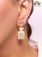 Double C gold danglers with 5 in CZ on white enamel