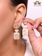 Double C gold danglers with 5 in CZ on white enamel