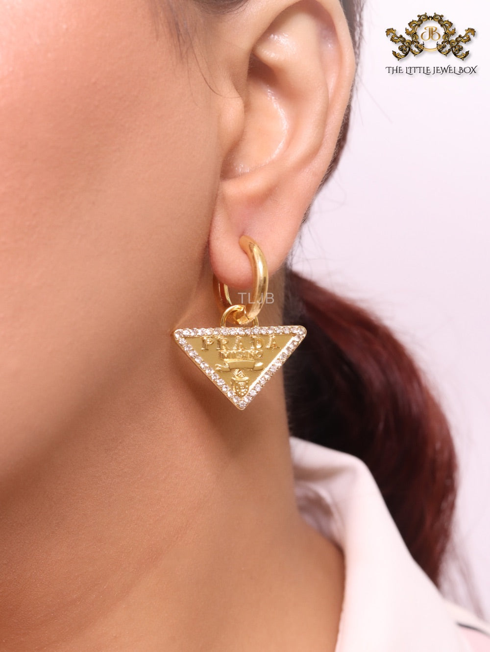 Gold Dangling Triangle earrings on small hoops with CZ
