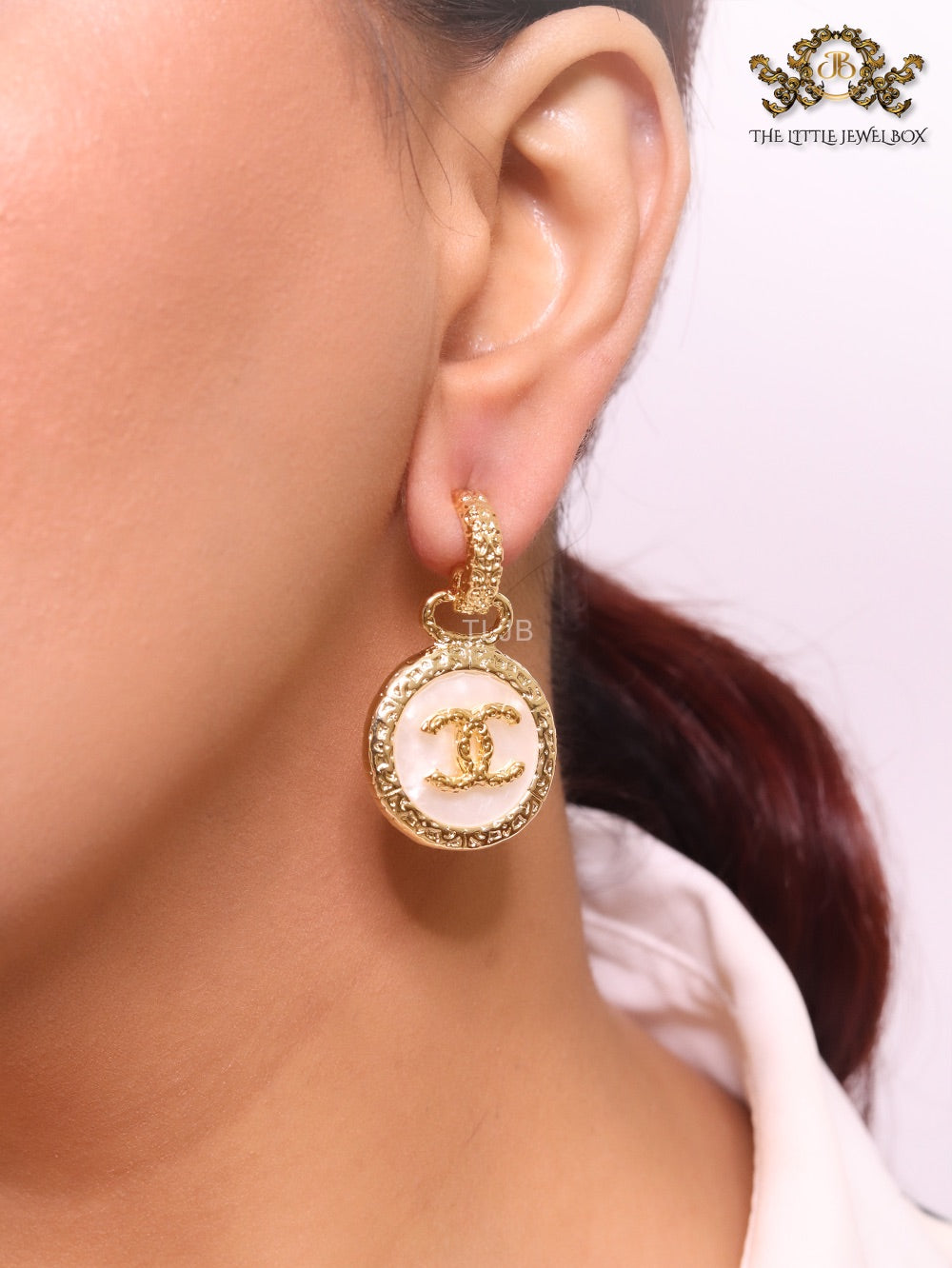 Double C on white enamel hanging gold earrings with CZ