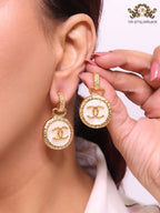 Double C on white enamel hanging gold earrings with CZ