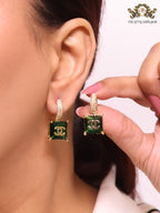 Double C on dangling green square gold earrings with CZ