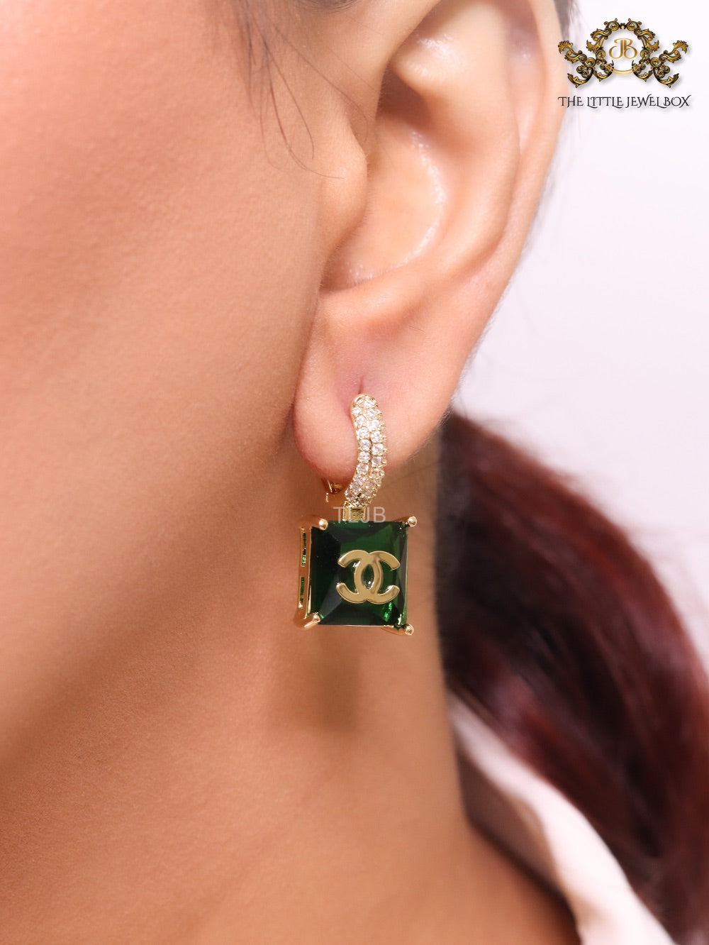Double C on dangling green square gold earrings with CZ