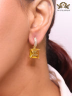 Double C on dangling yellow square gold earrings with CZ
