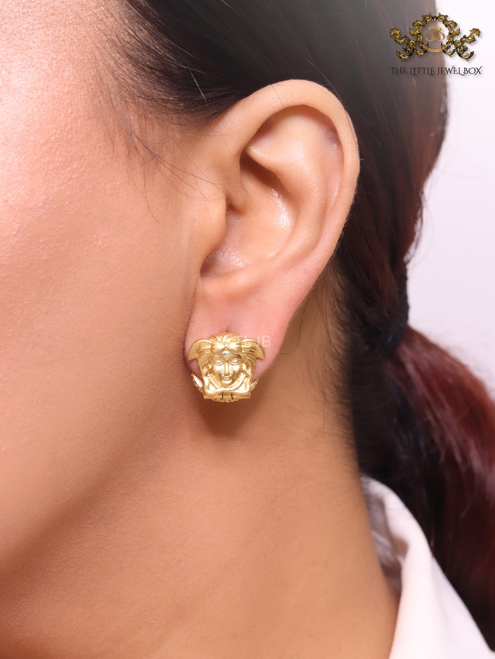 Reversible gold medusa studs with cz