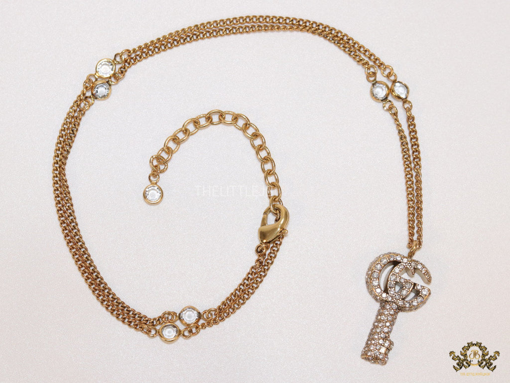 Gold plated chain necklace with cz G and key pendant
