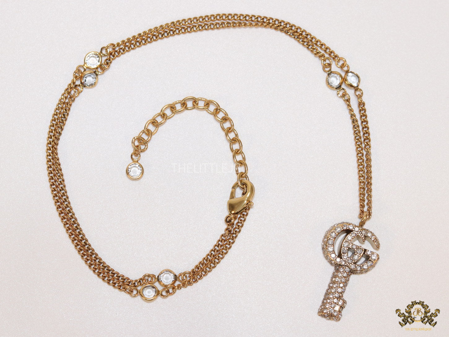 Gold plated chain necklace with cz G and key pendant